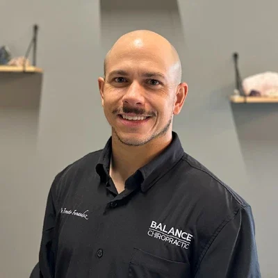 A headshot photo of Dr. Ernesto Fernandez, a chiropractor at Balance Chiropractic